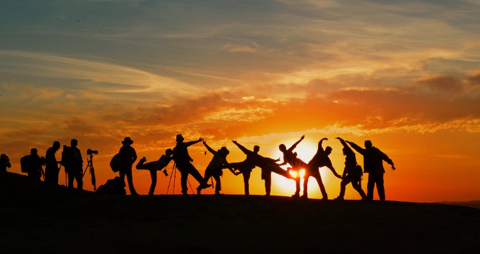 group of people in a sunset